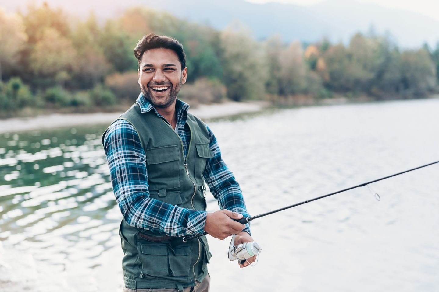man with BPPV fishing in a river