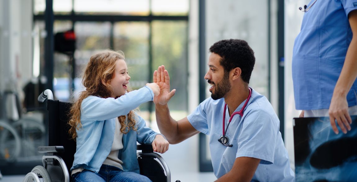 physician greeting pediatric patient