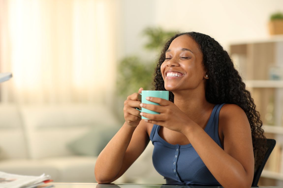woman smiling with coffee